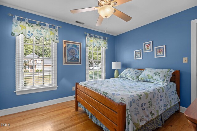 8004 Gabriels Bend Dr, Raleigh, NC 27612 - bedroom featuring wood finished floors and a ceiling fan