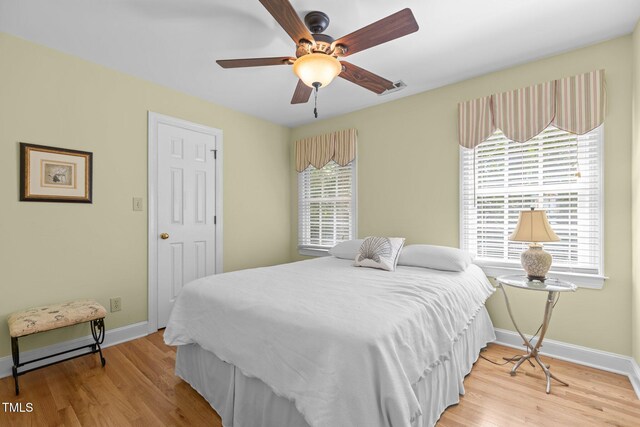 8004 Gabriels Bend Dr, Raleigh, NC 27612 - bedroom with light wood-style flooring and a ceiling fan
