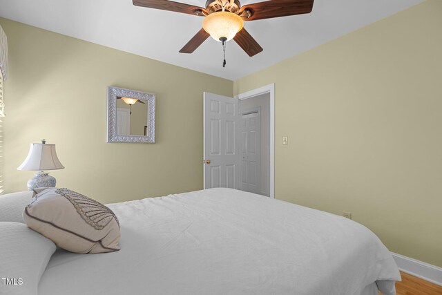 8004 Gabriels Bend Dr, Raleigh, NC 27612 - bedroom with wood finished floors and ceiling fan