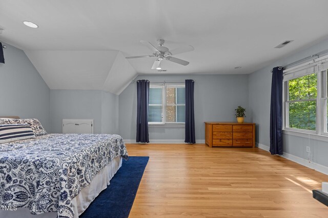 8004 Gabriels Bend Dr, Raleigh, NC 27612 - bedroom with multiple windows, light wood-type flooring, lofted ceiling, ceiling fan, and recessed lighting