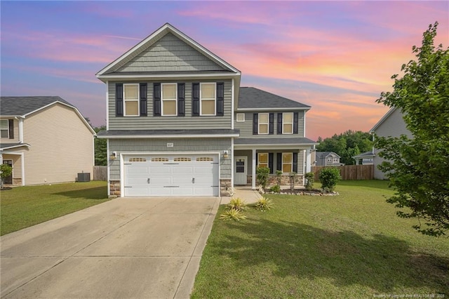 807 Roanoke Dr, Raeford, NC 28376 - view of front of home featuring concrete driveway, a porch, stone siding, and a garage
