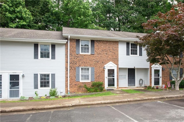 1255 Donaldson Ct, Cary, NC 27511 - view of property with uncovered parking and roof with shingles