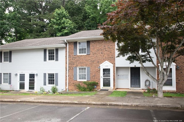 1255 Donaldson Ct, Cary, NC 27511 - view of front facade with uncovered parking and brick siding