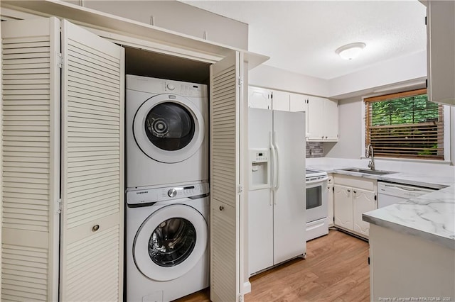 1255 Donaldson Ct, Cary, NC 27511 - washroom with stacked washer / dryer and light wood-type flooring