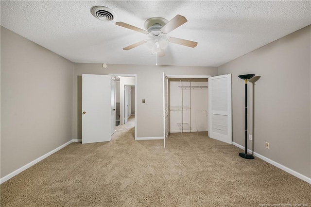 1255 Donaldson Ct, Cary, NC 27511 - unfurnished bedroom featuring carpet floors, a textured ceiling, a closet, baseboards, and ceiling fan