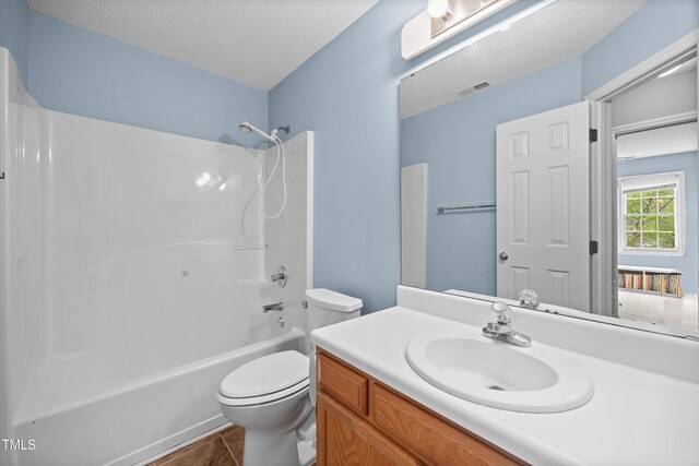 304 Gold Point Dr, Cary, NC 27519 - full bathroom featuring shower / bathtub combination, vanity, a textured ceiling, and tile patterned floors