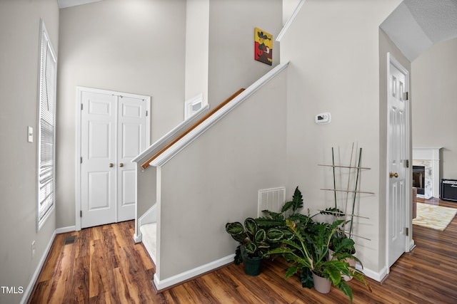 304 Gold Point Dr, Cary, NC 27519 - entrance foyer with wood finished floors, stairs, and a towering ceiling
