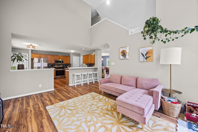 304 Gold Point Dr, Cary, NC 27519 - living area with wood finished floors, high vaulted ceiling, and healthy amount of natural light