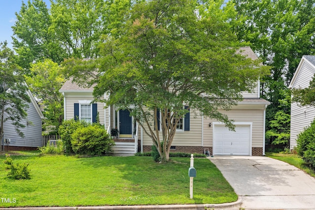 304 Gold Point Dr, Cary, NC 27519 - view of property hidden behind natural elements featuring a front yard, concrete driveway, and an attached garage