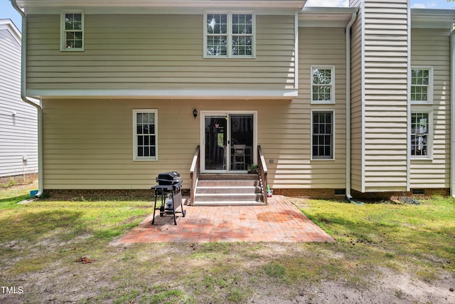 304 Gold Point Dr, Cary, NC 27519 - back of house featuring entry steps, a patio area, crawl space, and a lawn