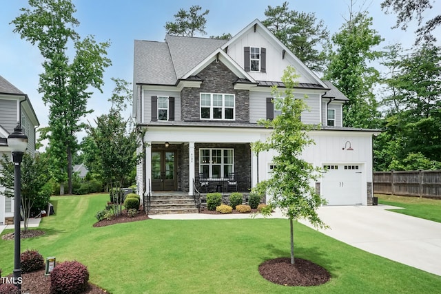 4104 Green Chase Way, Apex, NC 27539 - craftsman-style home with stone siding, a porch, concrete driveway, a standing seam roof, and an attached garage
