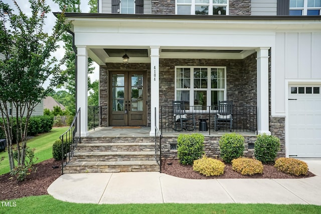 4104 Green Chase Way, Apex, NC 27539 - view of exterior entry featuring covered porch, board and batten siding, stone siding, and french doors