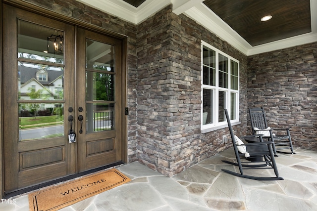 4104 Green Chase Way, Apex, NC 27539 - view of exterior entry featuring french doors, a porch, and stone siding
