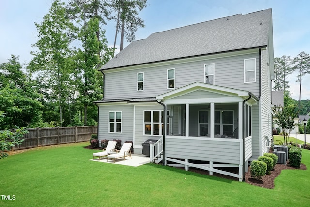 4104 Green Chase Way, Apex, NC 27539 - rear view of property featuring a sunroom, a patio, and a shingled roof