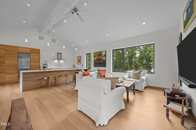 4725 Creeks Junction Rd, Blounts Creek, NC 27814 - living room featuring light wood-style floors, beam ceiling, high vaulted ceiling, and a ceiling fan