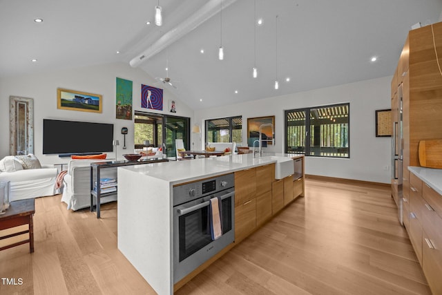 4725 Creeks Junction Rd, Blounts Creek, NC 27814 - kitchen featuring modern cabinets, open floor plan, light wood-style floors, oven, and a spacious island