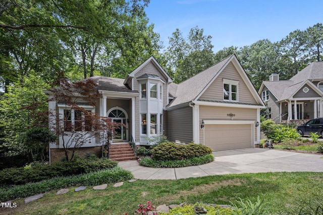 105 Gorge Ct, Cary, NC 27518 - victorian house with concrete driveway, roof with shingles, and an attached garage