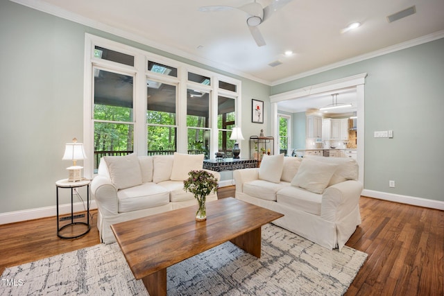 105 Gorge Ct, Cary, NC 27518 - living area with a ceiling fan, crown molding, wood finished floors, and recessed lighting