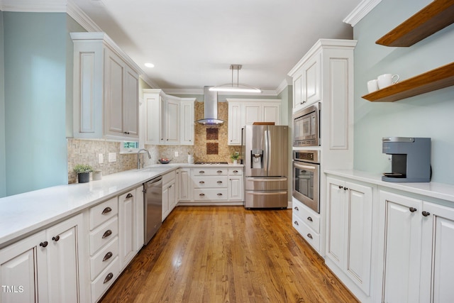 105 Gorge Ct, Cary, NC 27518 - kitchen with appliances with stainless steel finishes, wall chimney exhaust hood, tasteful backsplash, light countertops, and white cabinetry
