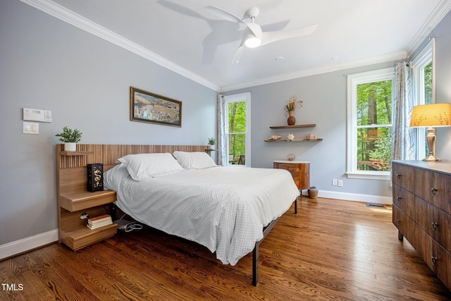 105 Gorge Ct, Cary, NC 27518 - bedroom with wood finished floors, ornamental molding, and a ceiling fan