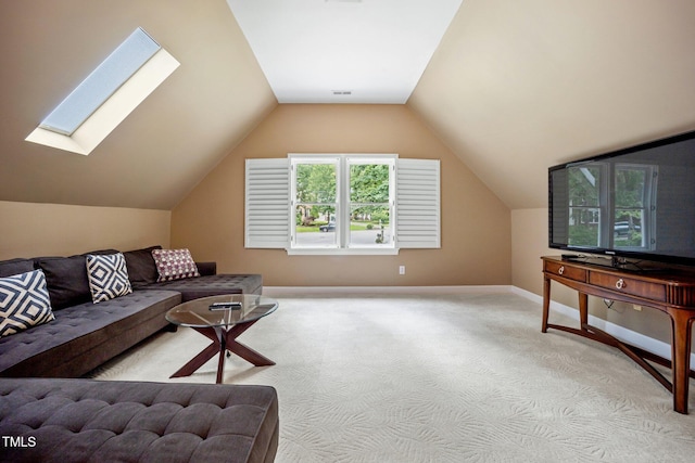 105 Gorge Ct, Cary, NC 27518 - living room with lofted ceiling, light colored carpet, and a skylight