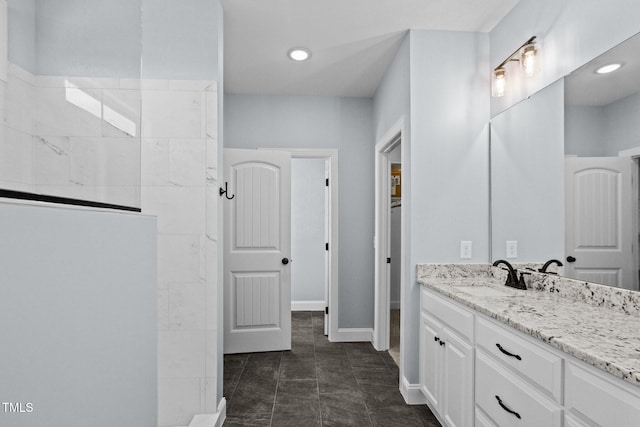 2237 Heartland Rd, Battleboro, NC 27809 - bathroom featuring vanity, walk in shower, recessed lighting, and baseboards