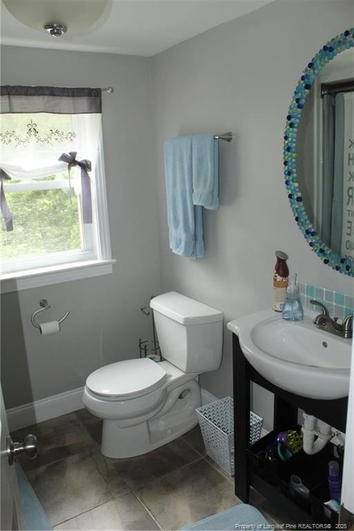 4903 Lemon Springs Rd, Sanford, NC 27332 - bathroom with toilet, baseboards, and a sink