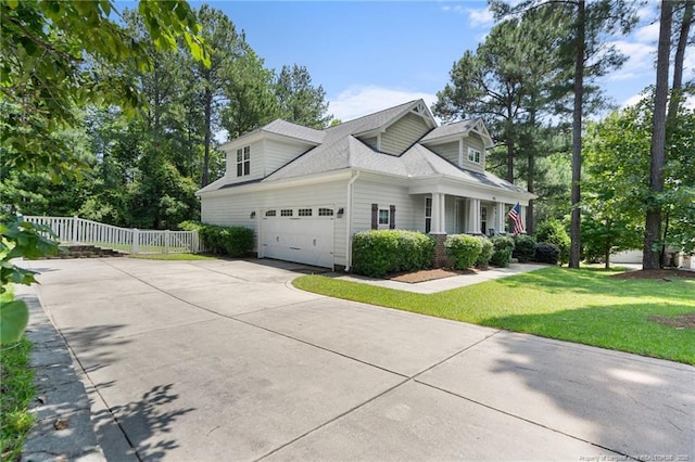 951 Whispering Pines Dr, Spring Lake, NC 28390 - view of side of home with driveway, a shingled roof, and an attached garage