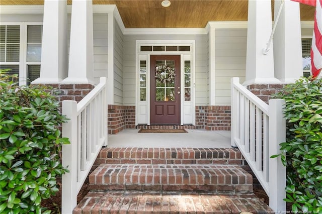 951 Whispering Pines Dr, Spring Lake, NC 28390 - view of exterior entry featuring a porch and brick siding
