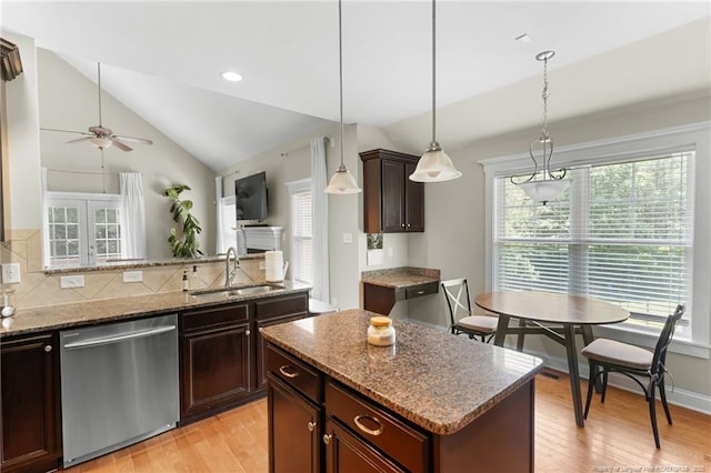 951 Whispering Pines Dr, Spring Lake, NC 28390 - kitchen with stainless steel dishwasher, a sink, lofted ceiling, light wood-style floors, and a ceiling fan