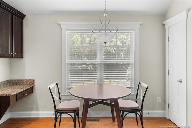 951 Whispering Pines Dr, Spring Lake, NC 28390 - dining room with baseboards and light wood-style floors