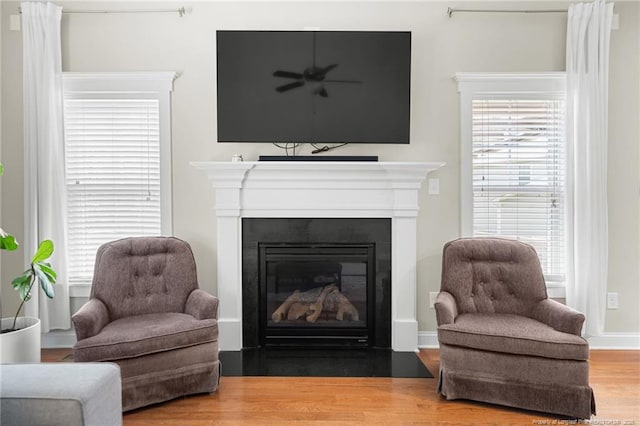951 Whispering Pines Dr, Spring Lake, NC 28390 - living area with a fireplace with flush hearth and wood finished floors
