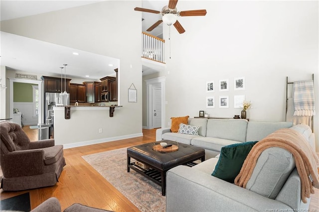 951 Whispering Pines Dr, Spring Lake, NC 28390 - living room with ceiling fan, light wood-type flooring, baseboards, recessed lighting, and a high ceiling