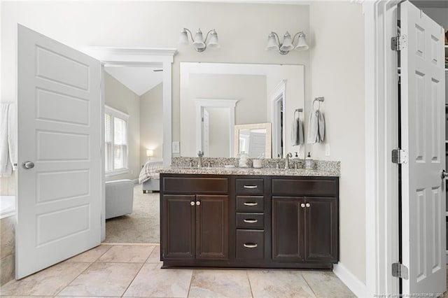 951 Whispering Pines Dr, Spring Lake, NC 28390 - full bath with double vanity, baseboards, tile patterned floors, lofted ceiling, and a bath