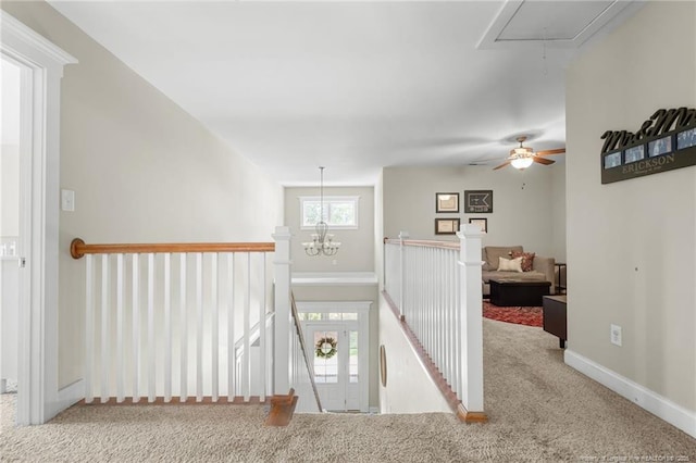 951 Whispering Pines Dr, Spring Lake, NC 28390 - hall with attic access, an upstairs landing, carpet, baseboards, and a chandelier