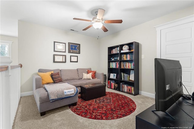 951 Whispering Pines Dr, Spring Lake, NC 28390 - carpeted living room with ceiling fan and baseboards