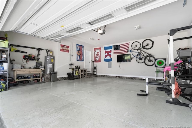 951 Whispering Pines Dr, Spring Lake, NC 28390 - garage with water heater and a garage door opener