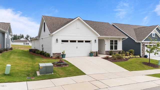 1319 Richfield Oaks Dr, Fuquay Varina, NC 27526 - view of front of home with a front lawn, concrete driveway, a shingled roof, and an attached garage