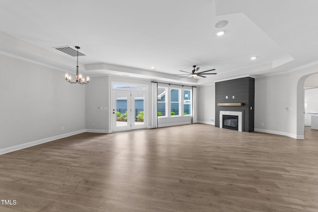1319 Richfield Oaks Dr, Fuquay Varina, NC 27526 - unfurnished living room with ceiling fan, arched walkways, wood finished floors, a fireplace, and recessed lighting
