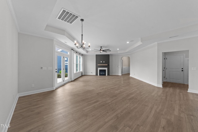 1319 Richfield Oaks Dr, Fuquay Varina, NC 27526 - unfurnished living room with a raised ceiling, a chandelier, wood finished floors, a large fireplace, and recessed lighting