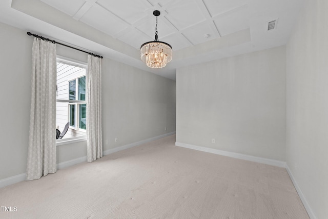 1319 Richfield Oaks Dr, Fuquay Varina, NC 27526 - empty room featuring carpet flooring, a chandelier, and a raised ceiling