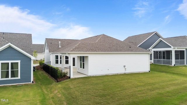 1319 Richfield Oaks Dr, Fuquay Varina, NC 27526 - rear view of house with a yard, a sunroom, and roof with shingles