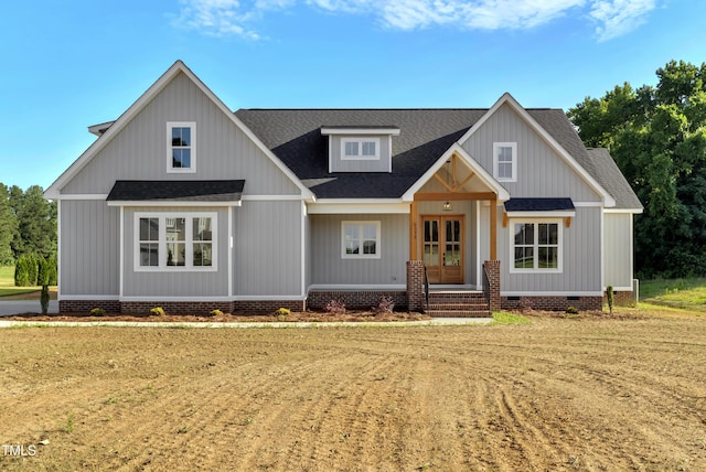 0 Radio Tower Rd, Wilson, NC 27893 - modern farmhouse style home with a shingled roof, french doors, crawl space, a front yard, and covered porch