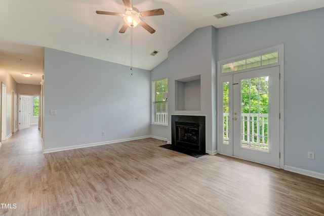 3010 Winston Dr Unit 81, Burlington, NC 27215 - unfurnished living room featuring light wood finished floors, ceiling fan, high vaulted ceiling, and a fireplace with flush hearth