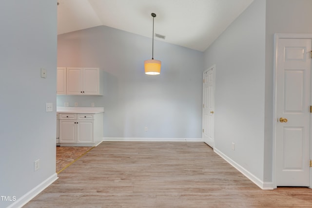 3010 Winston Dr Unit 81, Burlington, NC 27215 - unfurnished dining area featuring high vaulted ceiling and light wood finished floors