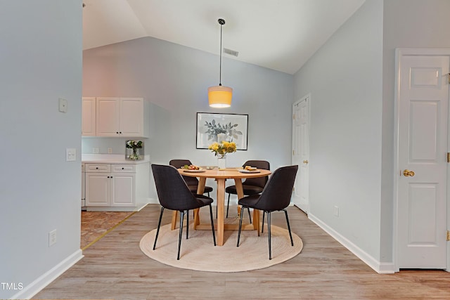 3010 Winston Dr Unit 81, Burlington, NC 27215 - dining area with high vaulted ceiling and light wood-type flooring