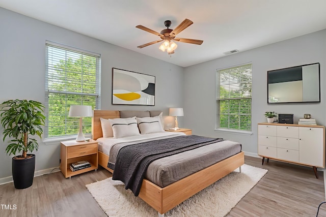 3010 Winston Dr Unit 81, Burlington, NC 27215 - bedroom featuring multiple windows, light wood-type flooring, and a ceiling fan