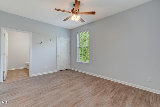 3010 Winston Dr Unit 81, Burlington, NC 27215 - unfurnished bedroom with light wood-style flooring, ensuite bath, and ceiling fan