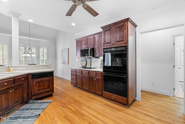 619 Baybush Dr, Raleigh, NC 27615 - kitchen featuring black appliances, a ceiling fan, light wood-type flooring, lofted ceiling, and light countertops