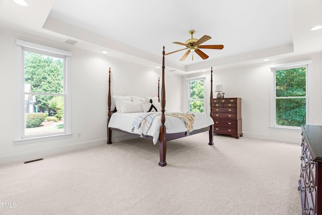 619 Baybush Dr, Raleigh, NC 27615 - bedroom with a raised ceiling, light colored carpet, recessed lighting, ceiling fan, and crown molding